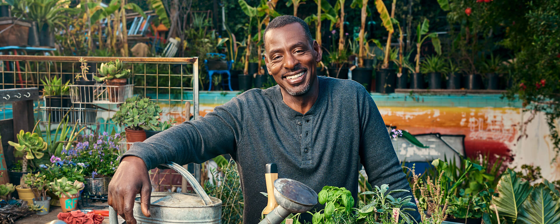 Ron Finley sits in his garden and talks with Capital One about his mission to fight food inequality and create better access to fresh produce in his community